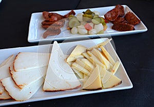 Mediterranean cuisine. Spanish tapas starters on a restaurant table.