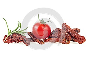 Mediterranean cuisine - sun dried tomatoes with fresh tomato and rosemary isolated on white background. Vegetarian concept