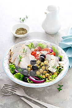 Mediterranean Greek and chickpea salad with fresh vegetables and feta cheese