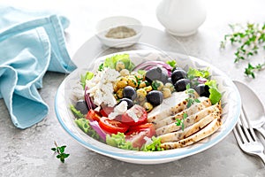 Mediterranean Greek and chickpea salad with fresh vegetables and feta cheese