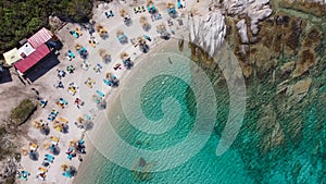 Mediterranean Greek landscape drone shot at Kavourotripes beach with bathers.