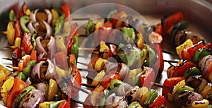 mediterranean grilled vegetable skewers in a serving dish photo