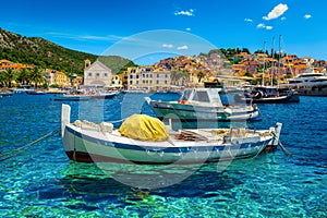 Mediterranean harbor with fishing boats and luxury yachts, Hvar, Croatia photo