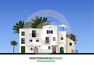 Mediterranean houses, palms and blue sky bakground. photo
