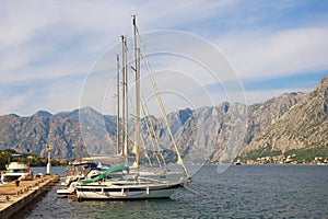 Mediterranean landscape with yachts moored at the pier. Montenegro