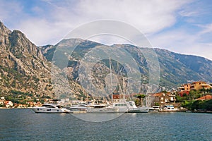 Mediterranean landscape with yachts moored at the pier. Montenegro, Adriatic Sea, Bay of Kotor