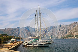 Mediterranean landscape with yachts moored at the pier. Montenegro , Bay of Kotor