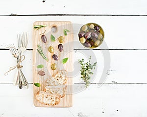 Mediterranean olives with herbs and ciabatta