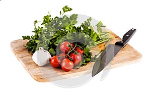 Mediterranean parsley garlic tomatoes and knife