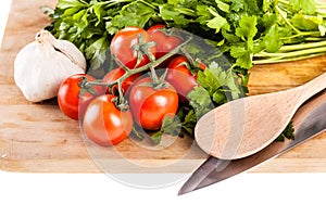 Mediterranean parsley garlic tomatoes and spoon