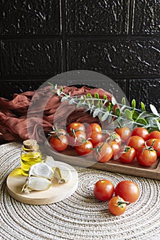 Mediterranean products: cherry tomatoes, extra virgin olive oil and garlic