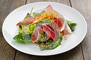 Mediterranean salad of prosciutto and vegetables