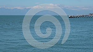 The Mediterranean Sea against the backdrop of snow-capped mountains in the village of Kundu Lara Antalya Turkey