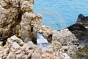 Mediterranean sea beach. Fantastic rocks. Summer day seascape. Clear Water texture. Drone view. Aerial view, sunny day