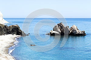 Mediterranean sea beach. White sand beach with lonely rock. Summer day seascape. Clear Water texture. Aerial view, sunny