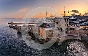 Mediterranean Sea with the lighthouse at sunset in the harbor, Nice, France