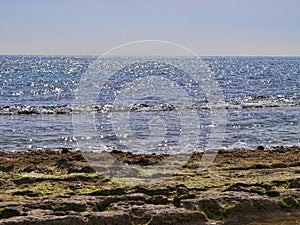 Mediterranean sea at noon with bright reflections