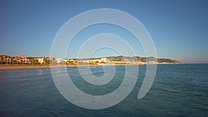 Mediterranean sea pier sunset viewon sitges bay 4k time lapse spain