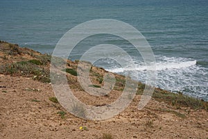 Mediterranean sea in spring. Deserted shorekurkar sandstone cliff nature reserve