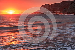 Mediterranean sea sunset at Port Ginesta beach, Sitges, Catalonia, Spain.