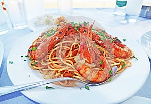mediterranean seafood - pasta with shrimps at a greek tavern