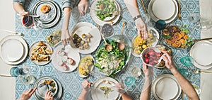 Mediterranean style dinner with various snacks and drinks, wide composition