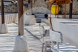 Mediterranean style interior in white and blue colors with rustic twig ceiling