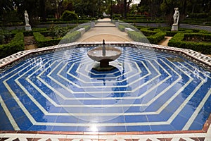 Mediterranean style tiled fountain in a park in Seville