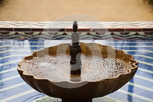 Mediterranean style tiled fountain in a park in Seville