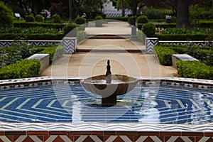 Mediterranean style tiled fountain in a park in Seville