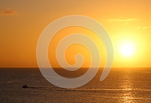 Mediterranean sunrise silhouette boat Qawra Malta