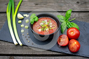 Mediterranean tomato soup with garlic, spring onions and basil