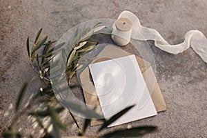 Mediterranean wedding stationery. Birthday mock-up. Blank greeting card, envelope on grunge concrete floor background