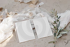 Mediterranean wedding stationery. Set of greeting cards, invitations mock ups on beige marble background. Olive tree