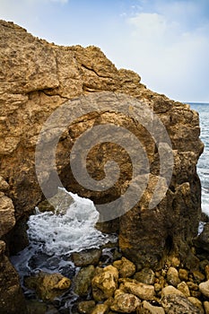Mediterranian Coast landscape and rock arch resembling horse head photo