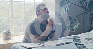 Man praying and murmuring