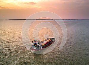 Medium container ship at estuary