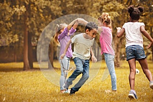 Medium group of children playing at public park.