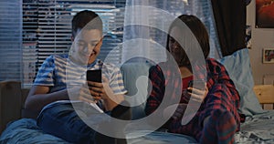 Siblings talking at night