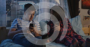 Siblings talking at night