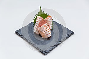 Medium Rare Salmon Sashimi Served with Ikura Salmon Roe and Sliced Radish in Stone Plate