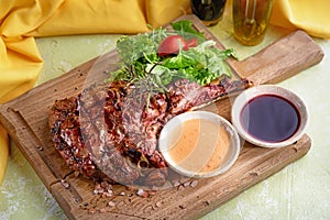 Medium Ribeye steak with spices on the wooden tray. Steak beef. Beef steak medium withwith mix salad.