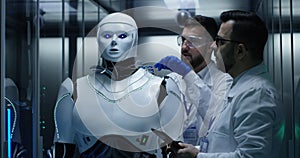 Engineers testing on robot controls inside the laboratory