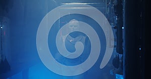 Humanoid robot working in a smoke filled lab