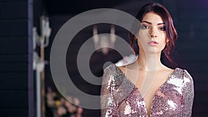 Medium shot portrait of beautiful Hispanic young female model defile at luxury background