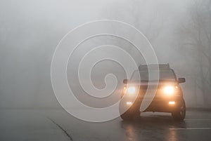 Medium Shot of SUV Lights in the Fog