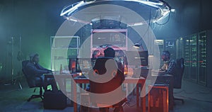 Young hackers coding on their computers