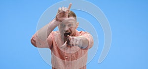 Young man taunting at camera