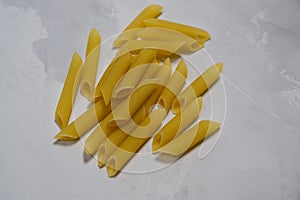 Medium size noodles on gray background