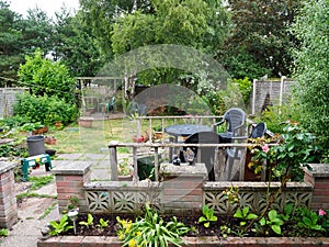 A medium-sized back garden fencing and flower beds